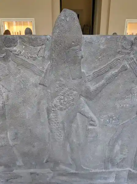 Reconstruction of Ashur water basin, man in fish clothes